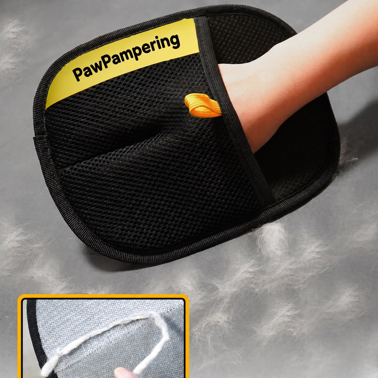 PawPampering glove worn on a hand above loose hair on fabric, with a cleaning-face inset